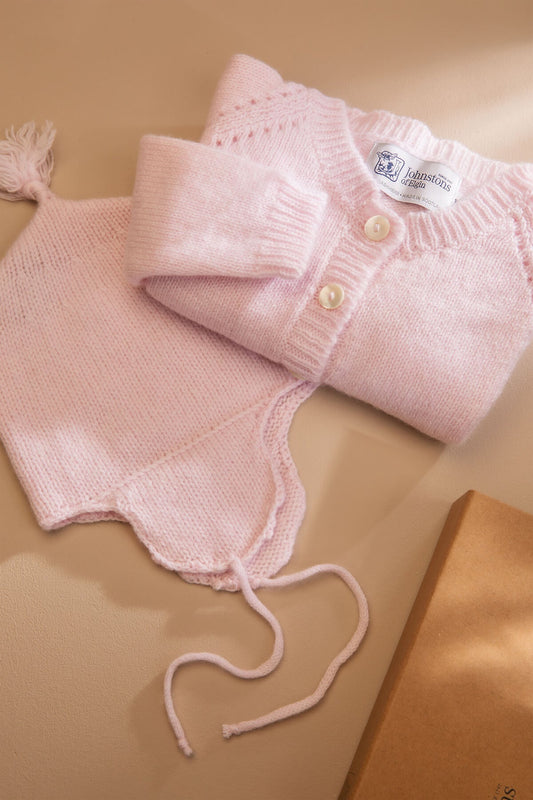 Johnstons of Elgin’s Baby's 1st Cashmere Cardigan Gift Set in Blush Pink on a beige background AW21GIFTSET19B