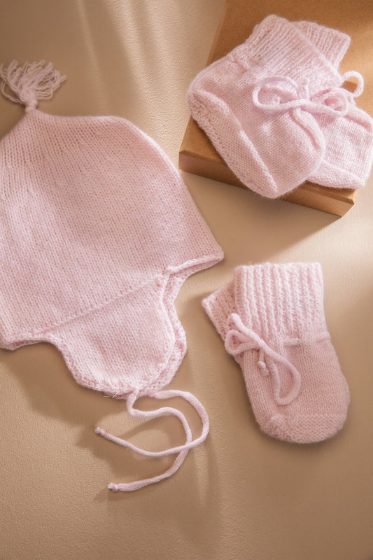 Johnstons of Elgin’s Baby's 1st Cashmere Accessories Gift Set in Blush Pink on a beige background AW21GIFTSET20B