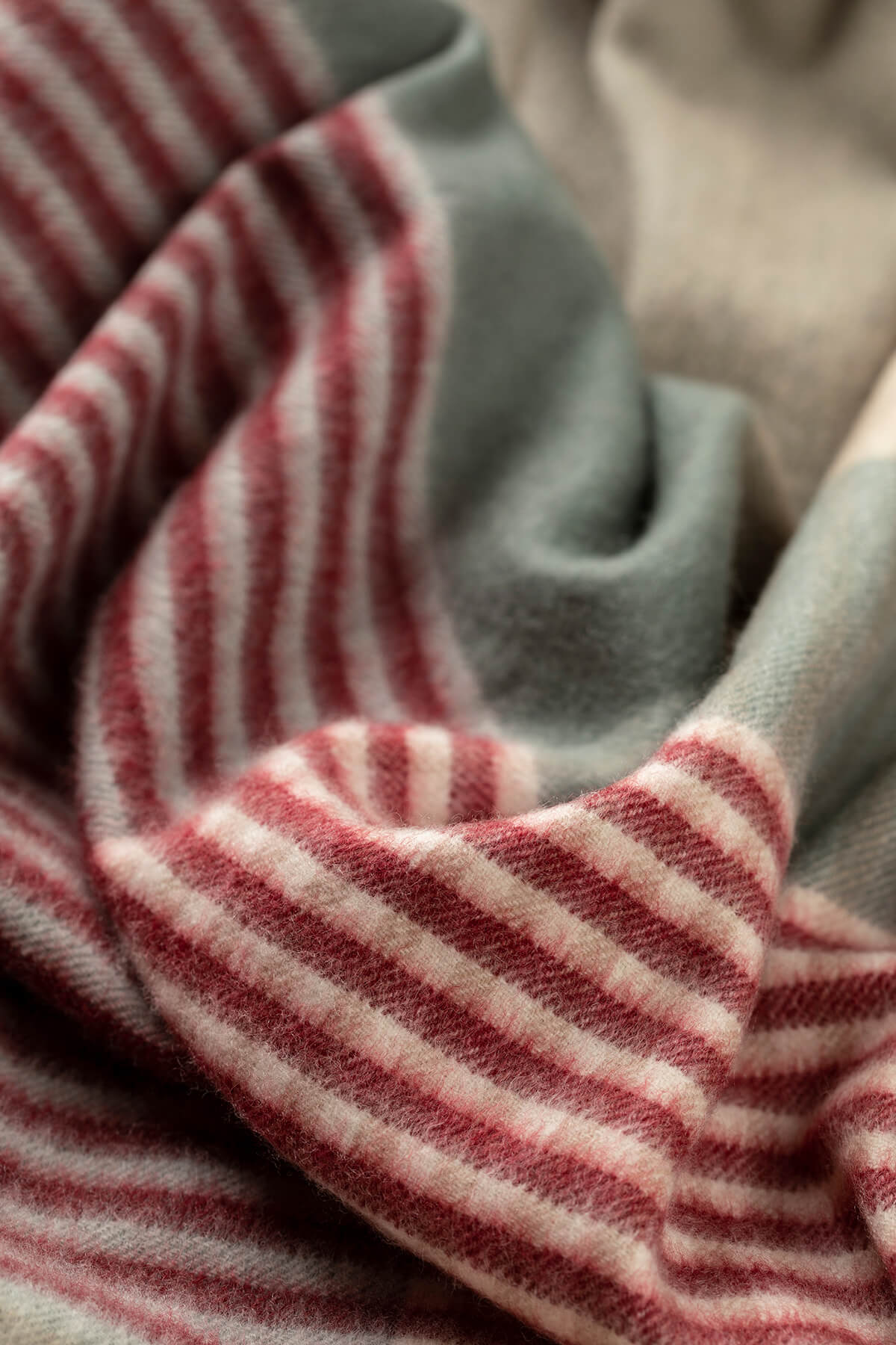 Close up of Johnstons of Elgin Red, Cream, and Grey Check Cashmere Christmas Blanket WA000055RU7450ONE