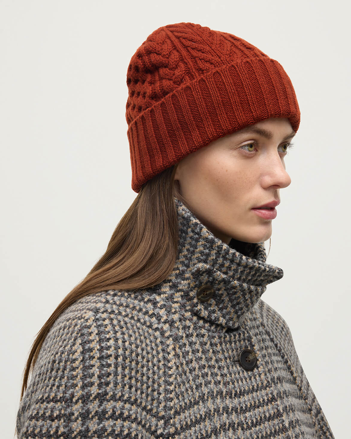 Model wearing Johnstons of Elgin AW25 Knitted Accessories Oxblood Aran Cable Red Cashmere Beanie HAC03411SG4463ONE