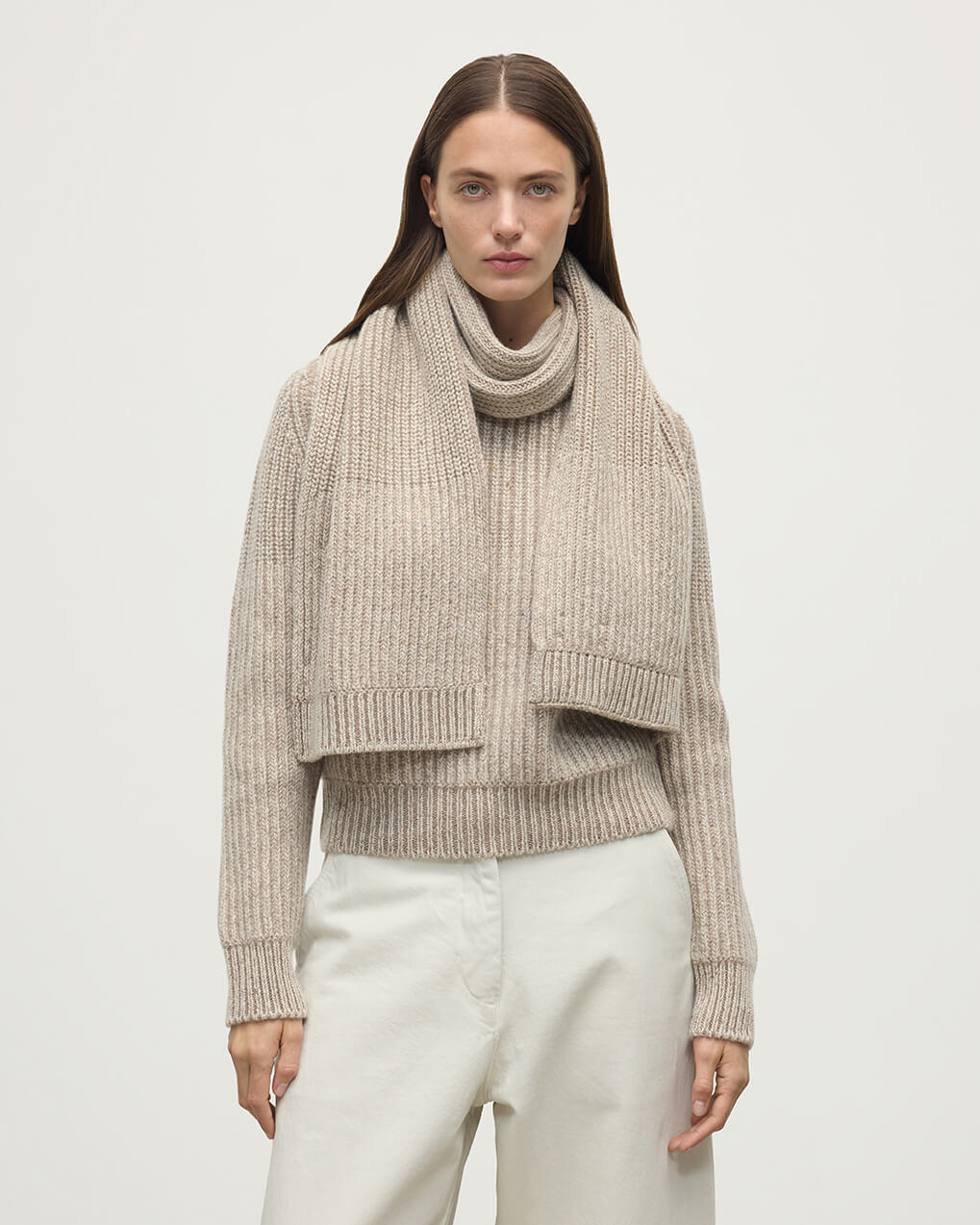 Model wears Johnstons of Elgin AW25 Knitted Accessories Cream Dun Donegal Cashmere Cream Knitted Scarf HAC03530Q25315ONE