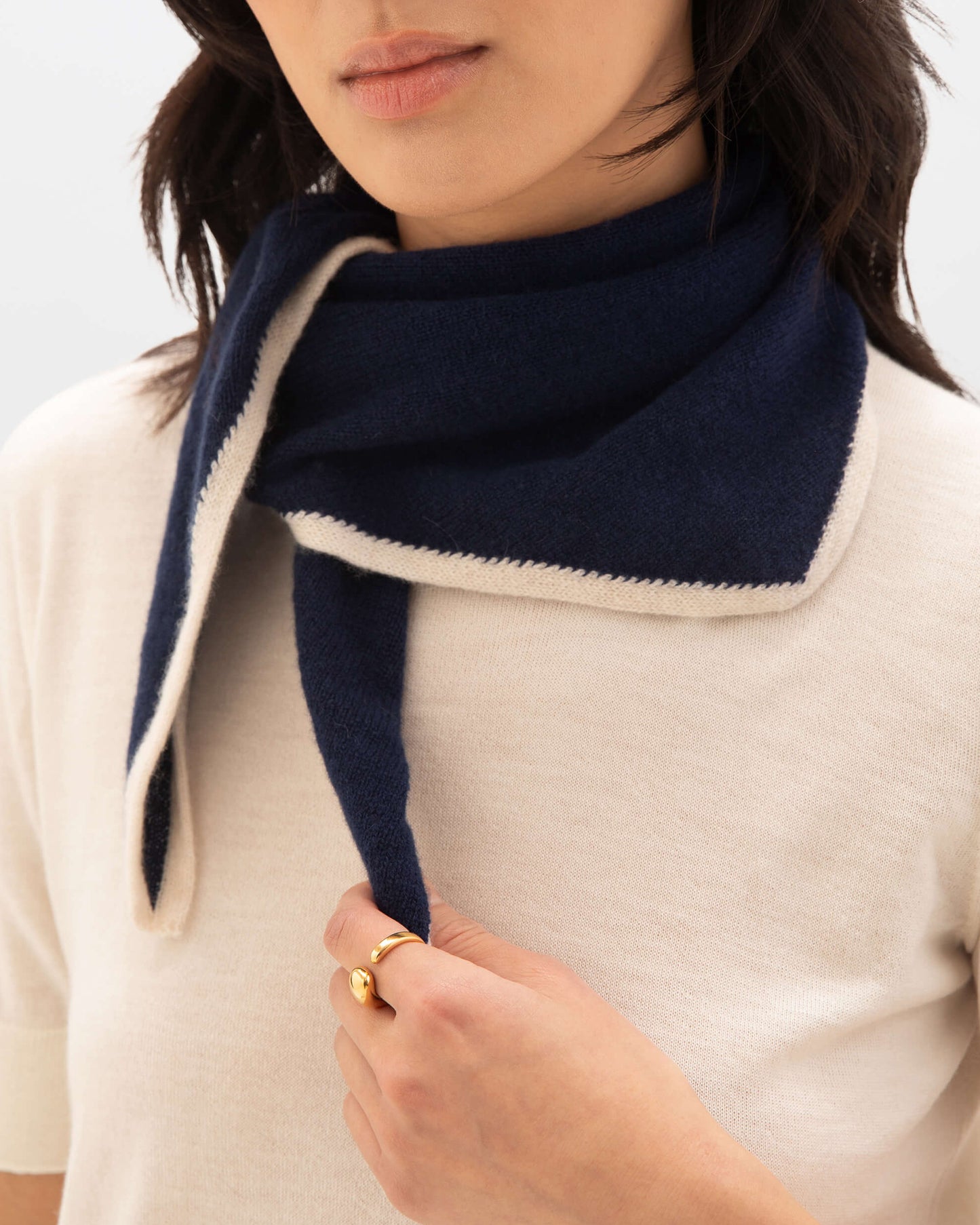 Model wearing Johnstons of Elgin Knitted Accessories Double Faced Navy Cashmere Triangle with short sleeve navy cashmere t-shirtHAE02939Q24454ONE