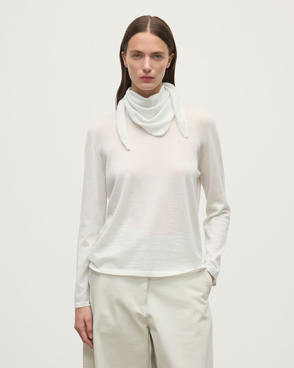 Model wearing Johnstons of Elgin AW25 Knitted Accessories Gauzy Cashmere White Triangle Neck Tie with matching cashmere sweater HAE03430HA0371ONE