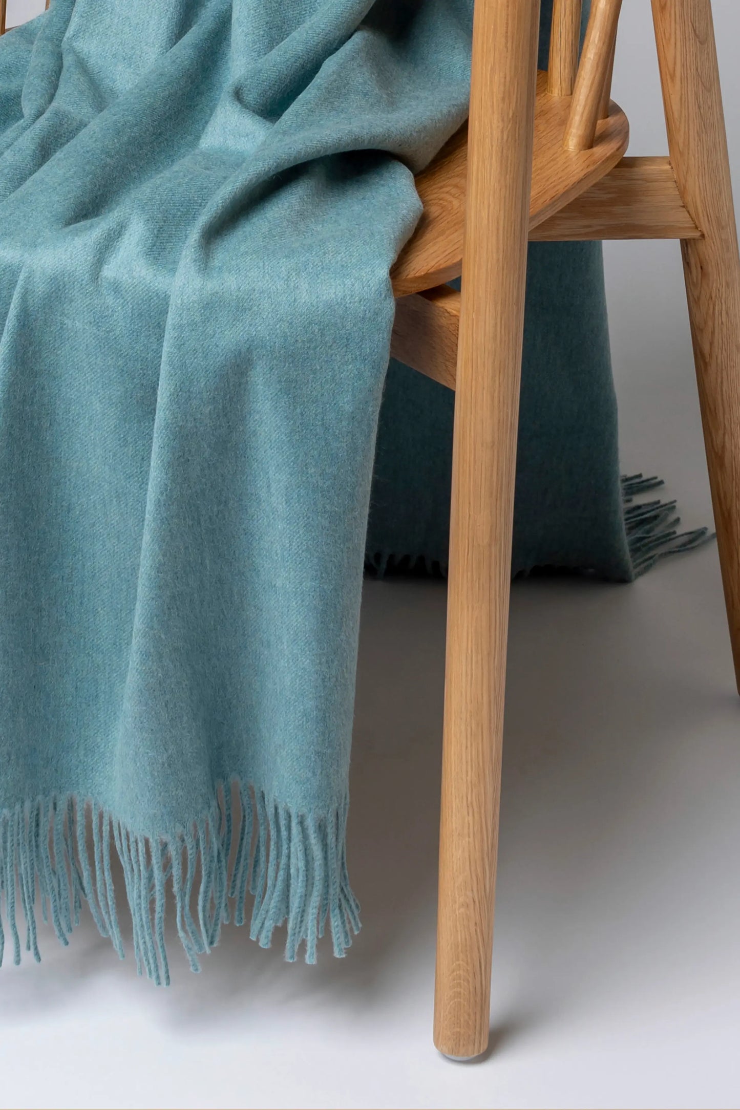 2025 Johnstons of Elgin Interiors Collection Seascape Seascape Cashmere Throw on a grey background WA000055HC4291ONE