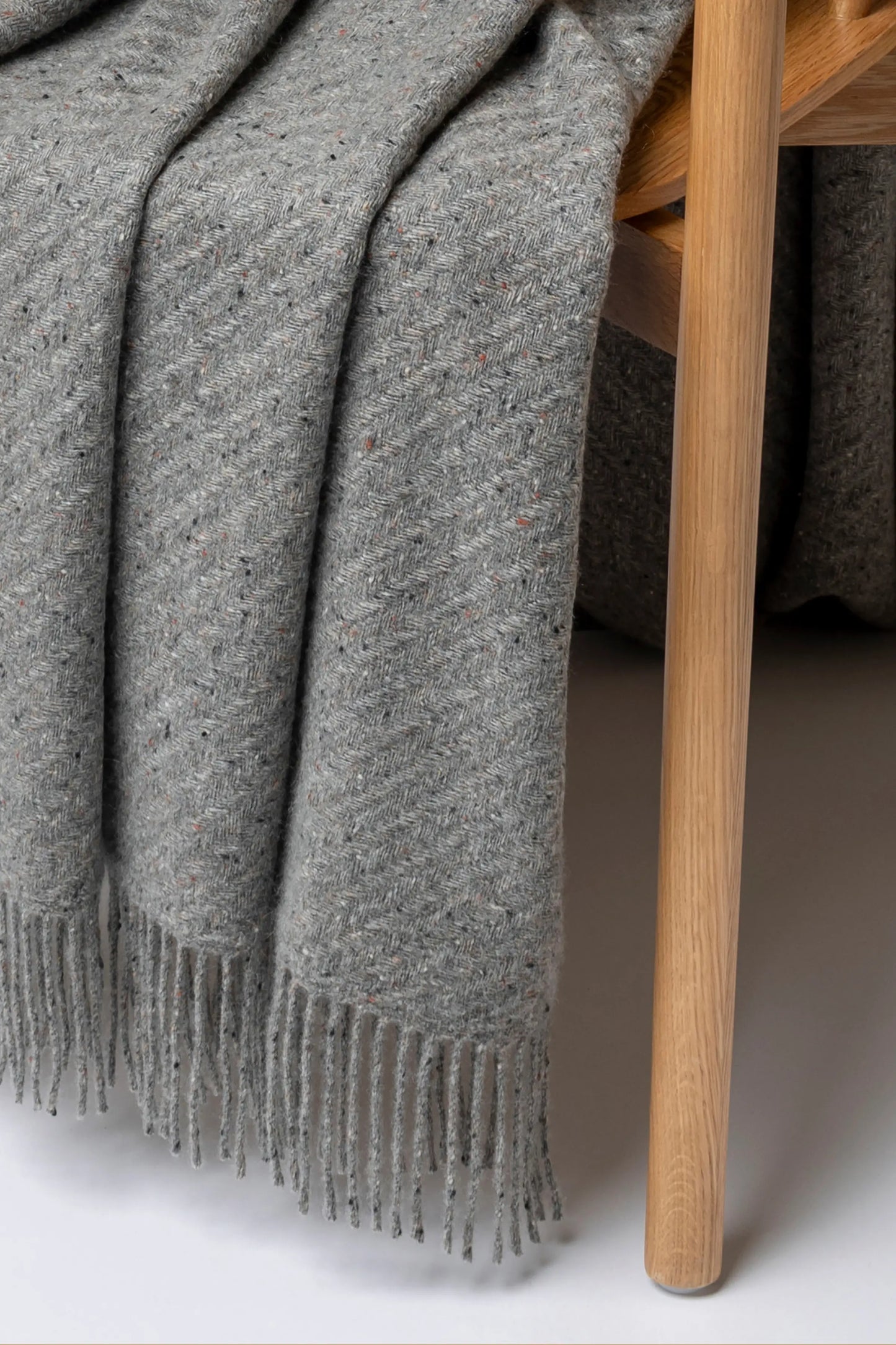 2025 Johnstons of Elgin Interiors Collection Peregrine Lofty Twill Cashmere Throw on a grey background WAC02308RU7653ONE