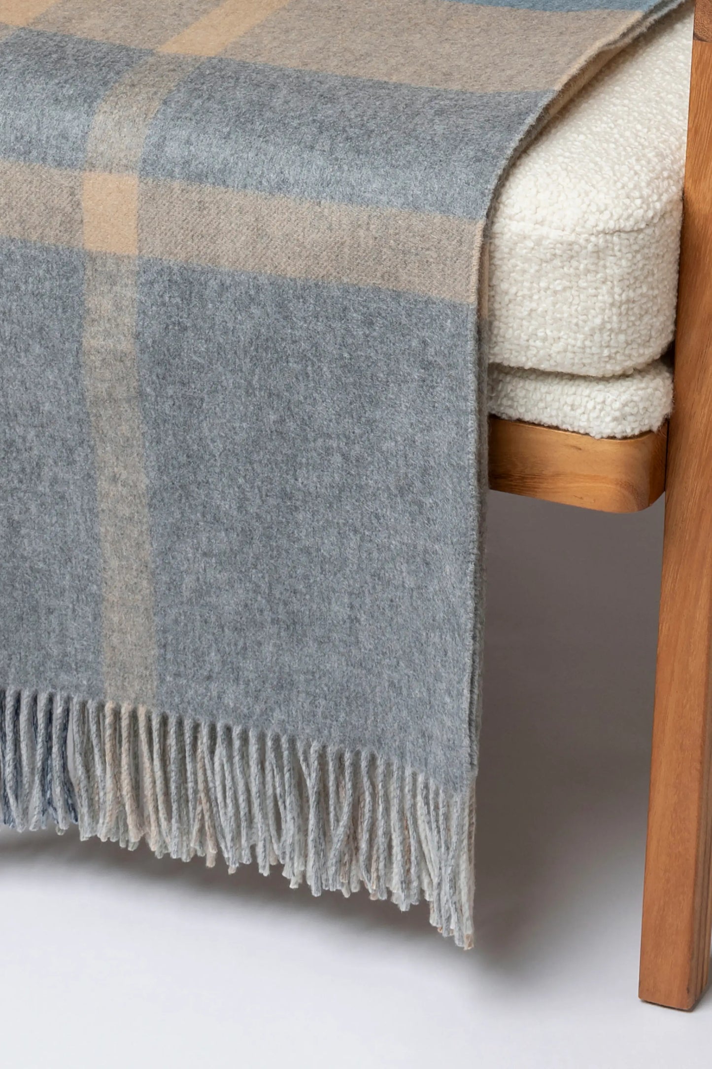 2025 Johnstons of Elgin Interiors Collection Birch Check Reversible Cashmere Throw on a grey background WA000013RU7603ONE