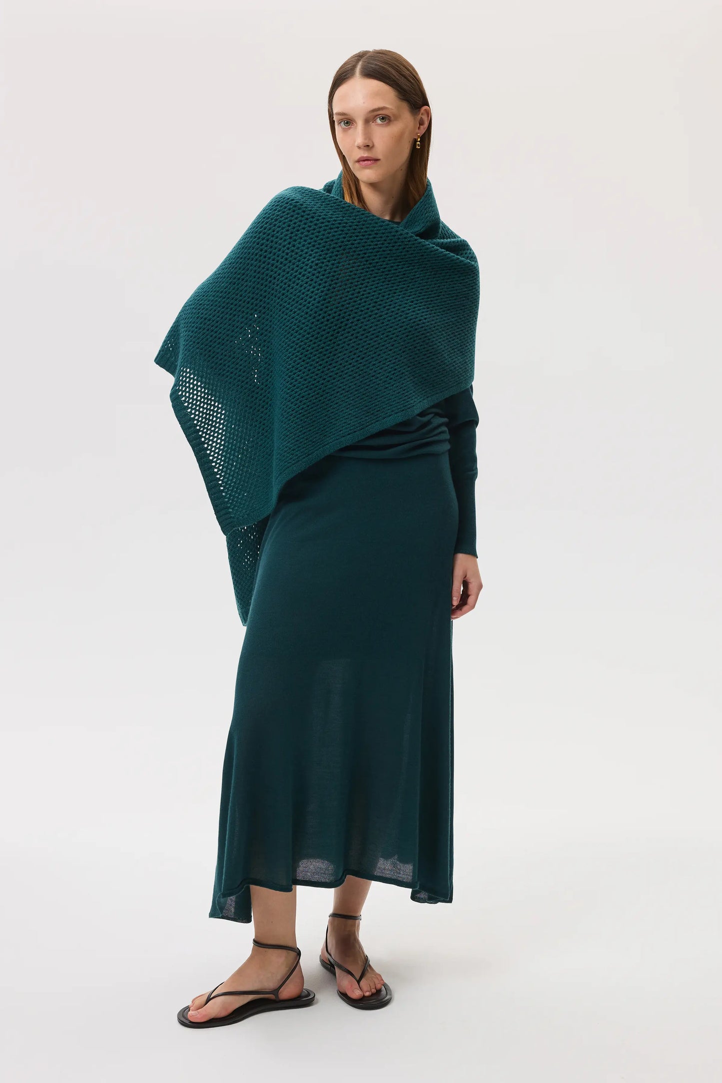 Johnstons of Elgin SS25 Women's Knitwear Emerald Cashmere Silk A-Line Skirt, with matching cashmere sweater and crochet wrap, against a white background KBI00976SC7242