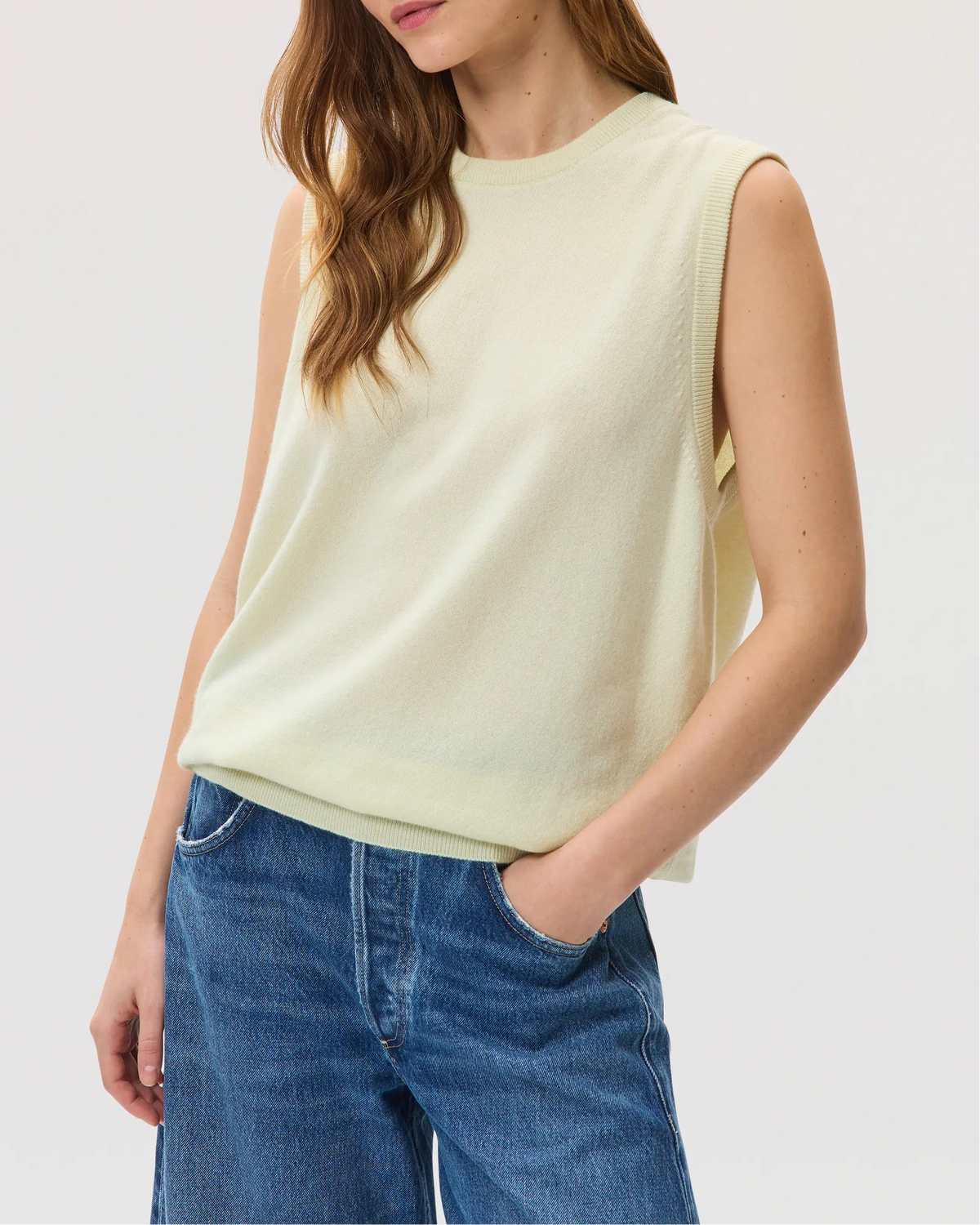 Female model wearing Johnstons of Elgin SS25 Unisex Knitwear Lemon Cashmere Tank with blue jeans KAP05243SA0145