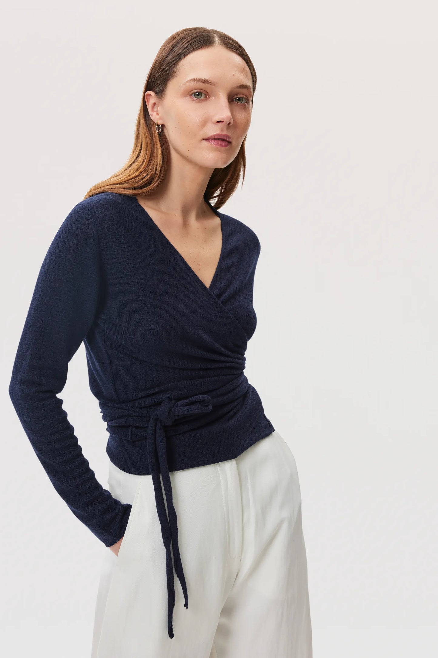 Model is wearing Johnstons of Elgin SS25 Women's Knitwear Navy Featherlight Cashmere Ballet Wrap on a white background KAP05408SD7286