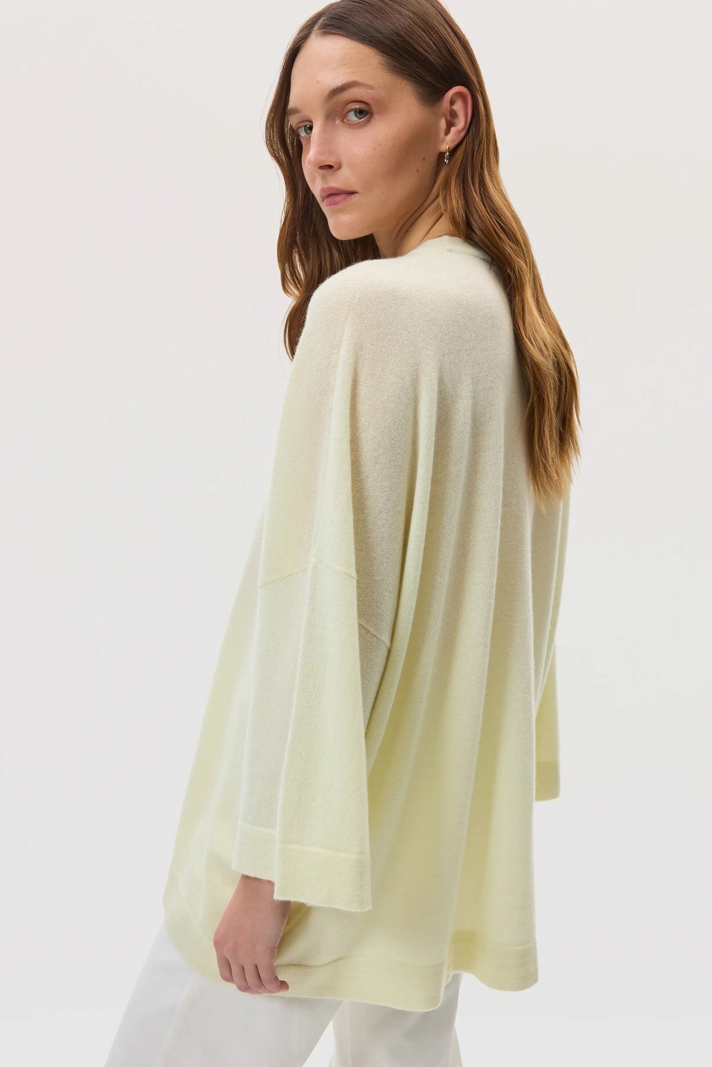 Johnstons of Elgin SS25 Women's Knitwear Lemon Relaxed Featherlight Cashmere Jumper on a pale backdrop KAP05426SA0145