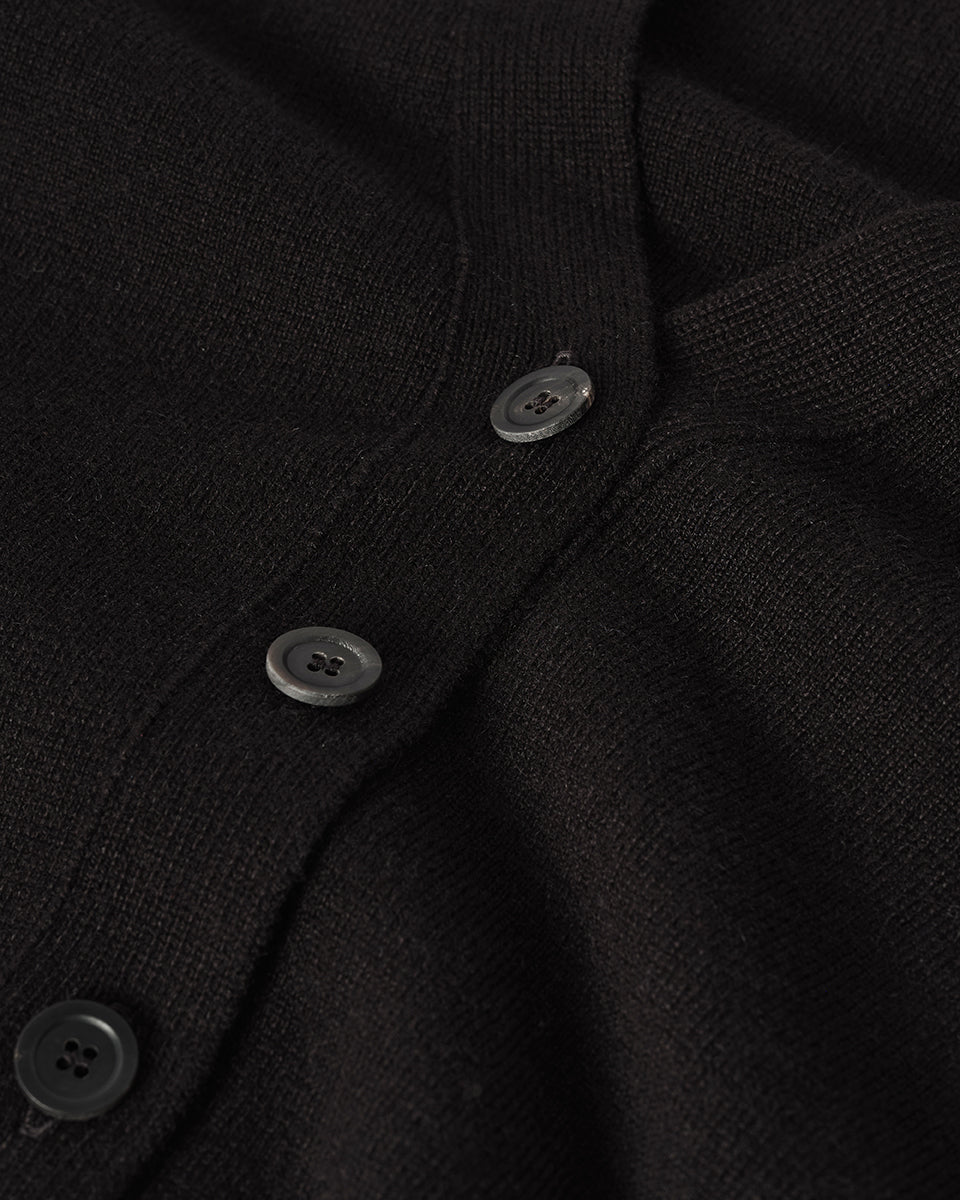 Johnstons of Elgin AW25 Women's Knitwear Black Milano Stitch Black Cashmere Cardigan over a white shirt neckline details KAP05489SA7210