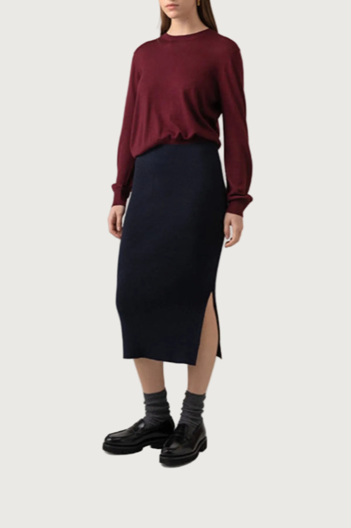 Johnstons of Elgin Ribbed Tube Cashmere Skirt in Dark Navy worn with matching Slim Fit Cashmere Sweater on a grey background KBP00923SD7286