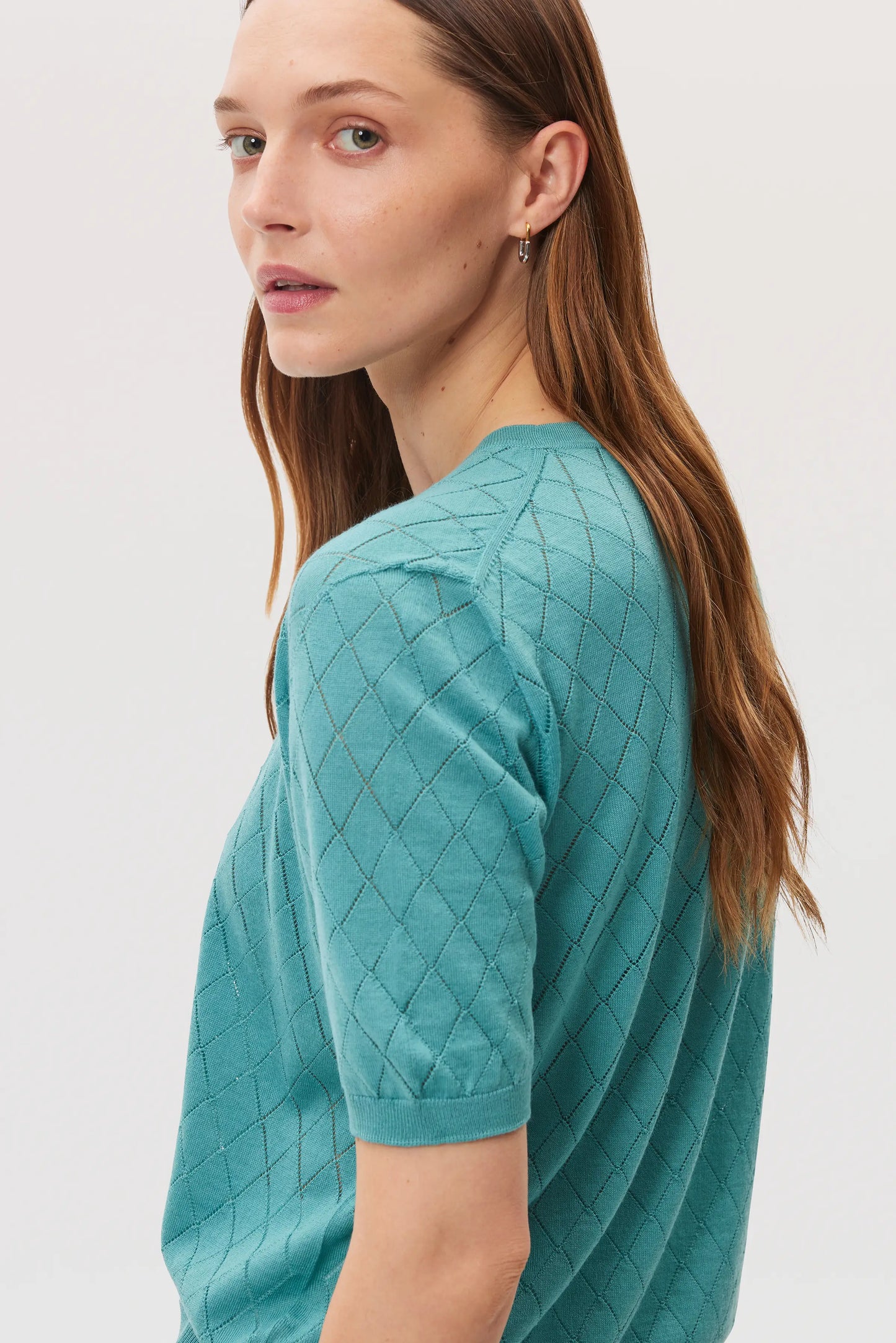 Model wears Johnstons of Elgin SS25 Women's Knitwear Jade Superfine Merino Pointelle Argyle T-Shirt KDI00739SC464