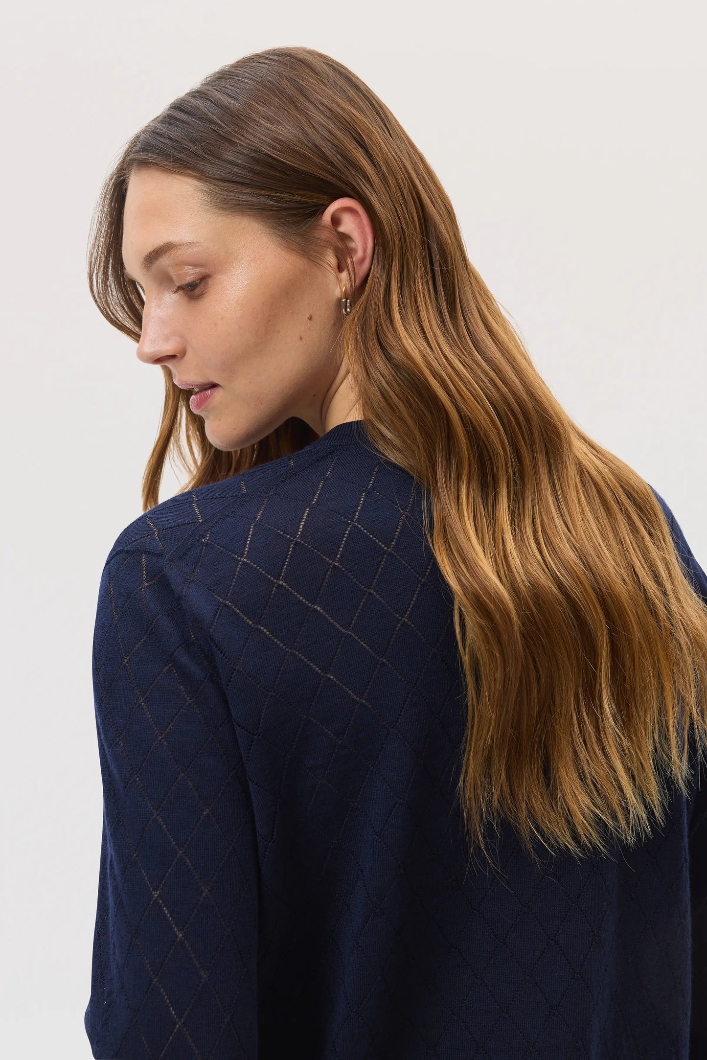 Johnstons of Elgin SS25 Women's Knitwear Navy Superfine Merino Pointelle Argyle Cardigan close up of fabric details KDI00742SD7563