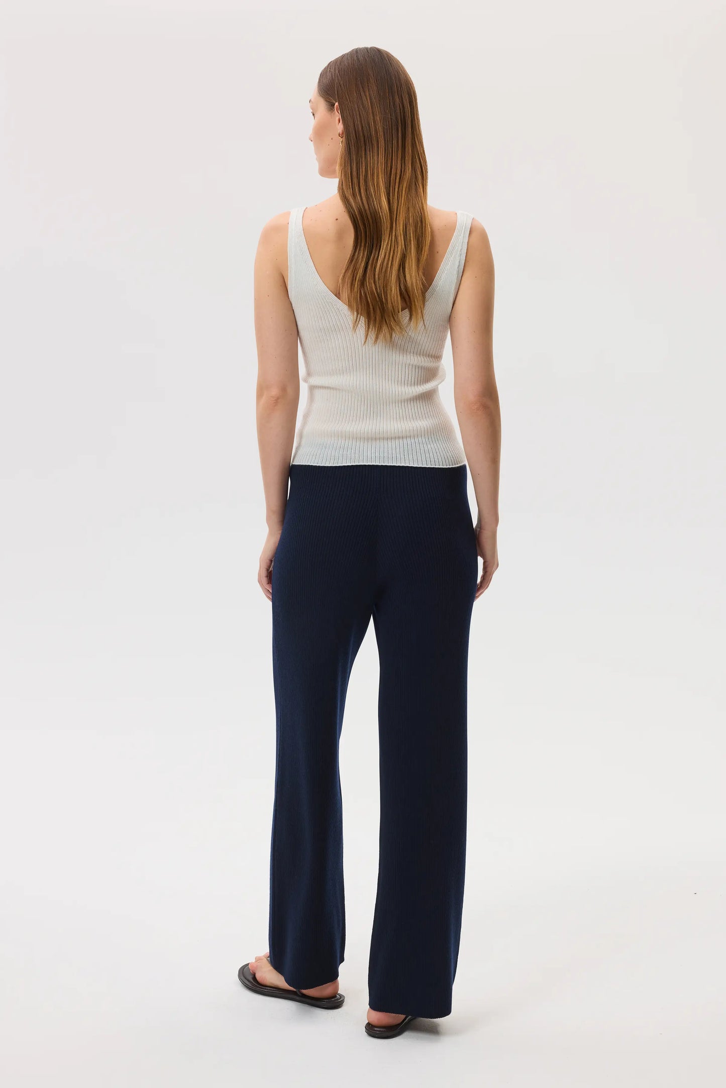 Johnstons of Elgin SS25 Women's Knitwear Navy Ribbed Merino Wide Leg Trousers with superfine cashmere ribbed vest top in white KDP00746SD7645