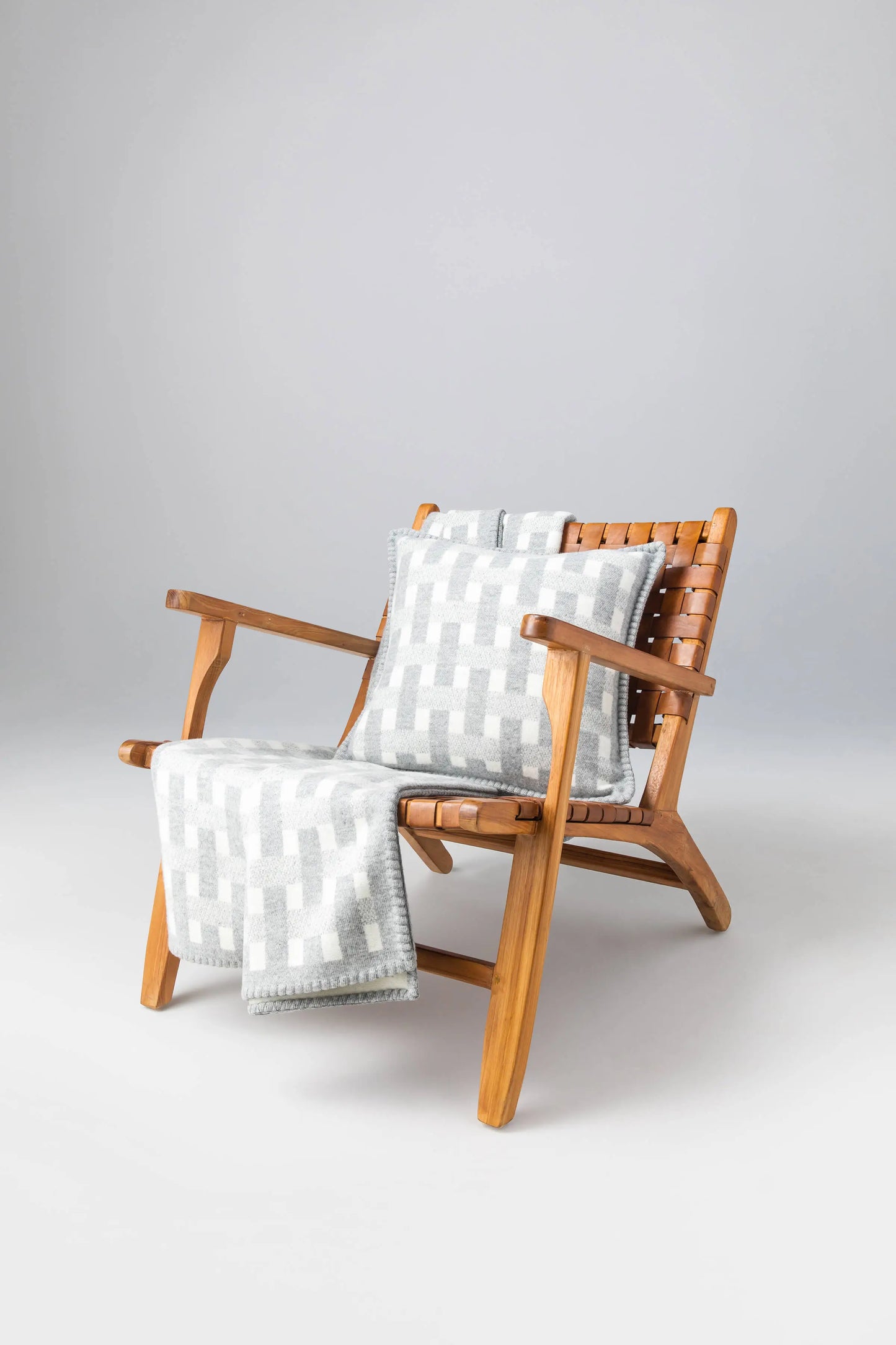 2025 Johnstons of Elgin Interiors Collection Light Grey & White Basketweave Cushion on a white background PB000059RU7446ONE