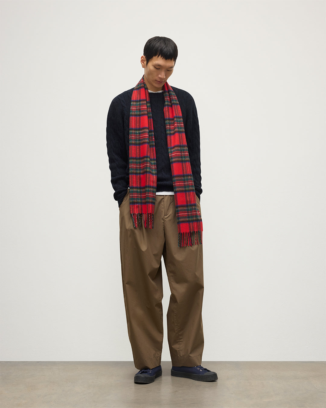 Male model wearing Johnstons of Elgin Tartan Cashmere Scarf in Royal Stewart on a white background WA000016KU0303N/A