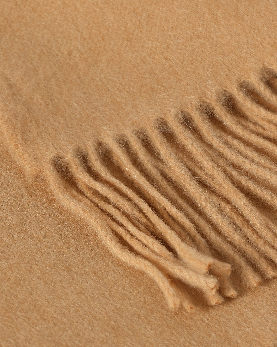 Johnstons of Elgin Interiors Collection Camel Camel Cashmere Throw on a wooden chair WA000055HB4315ONE