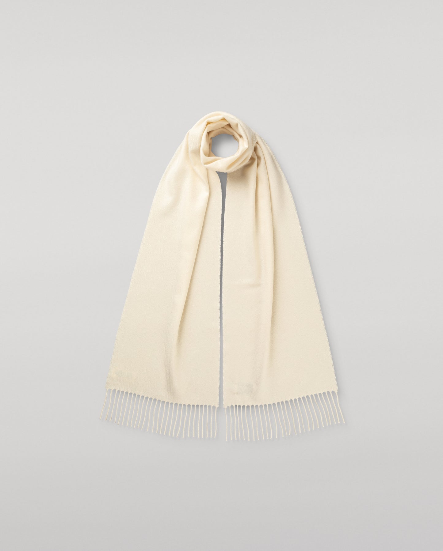 Johnstons of Elgin Cashmere Scarf in White on a white background WA000016SA0000ONE