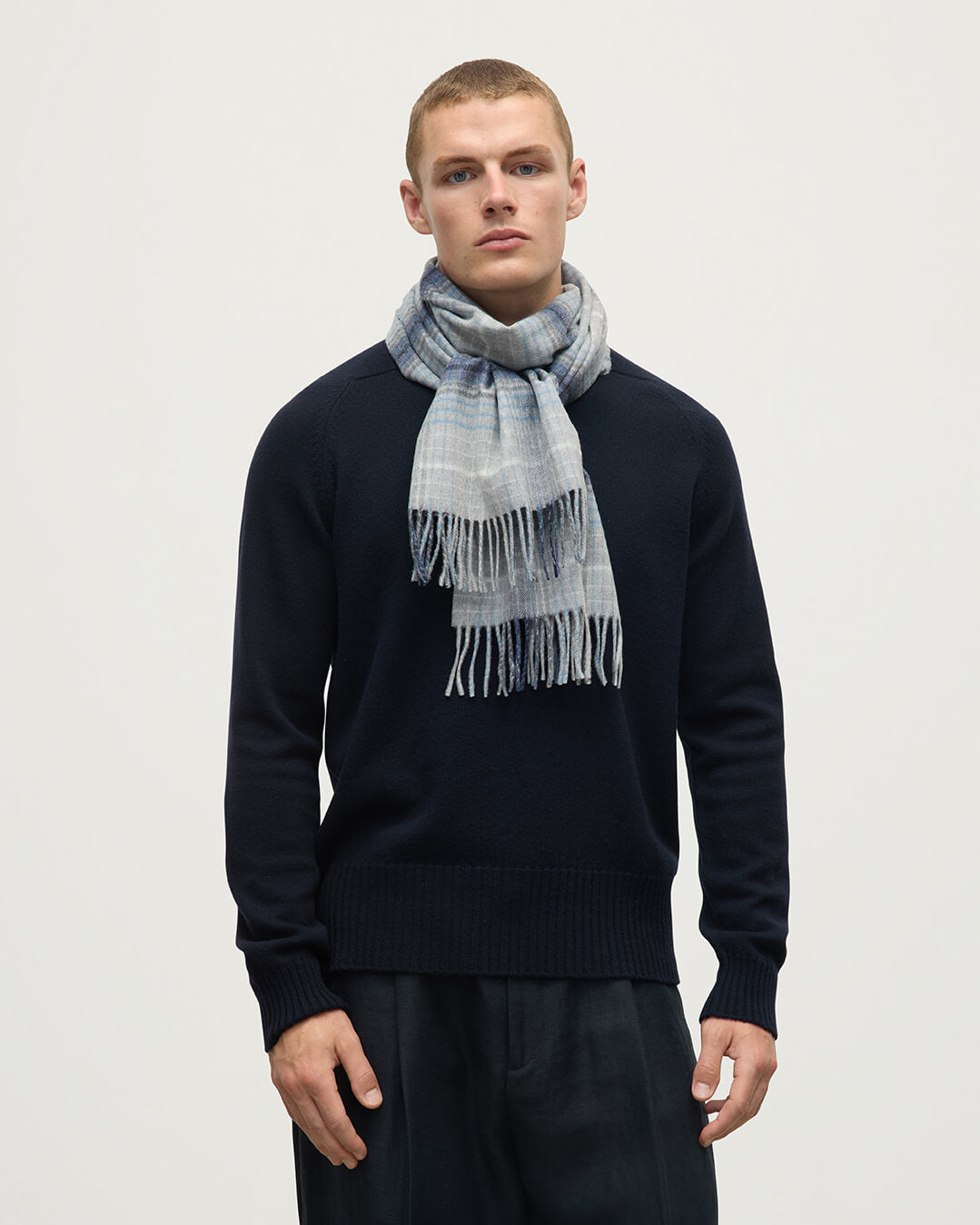 Model wears Johnstons of Elgin AW25 Woven Accessories Grey Ombre Check Grey Merino Scarf WDC01797RU7636ONE