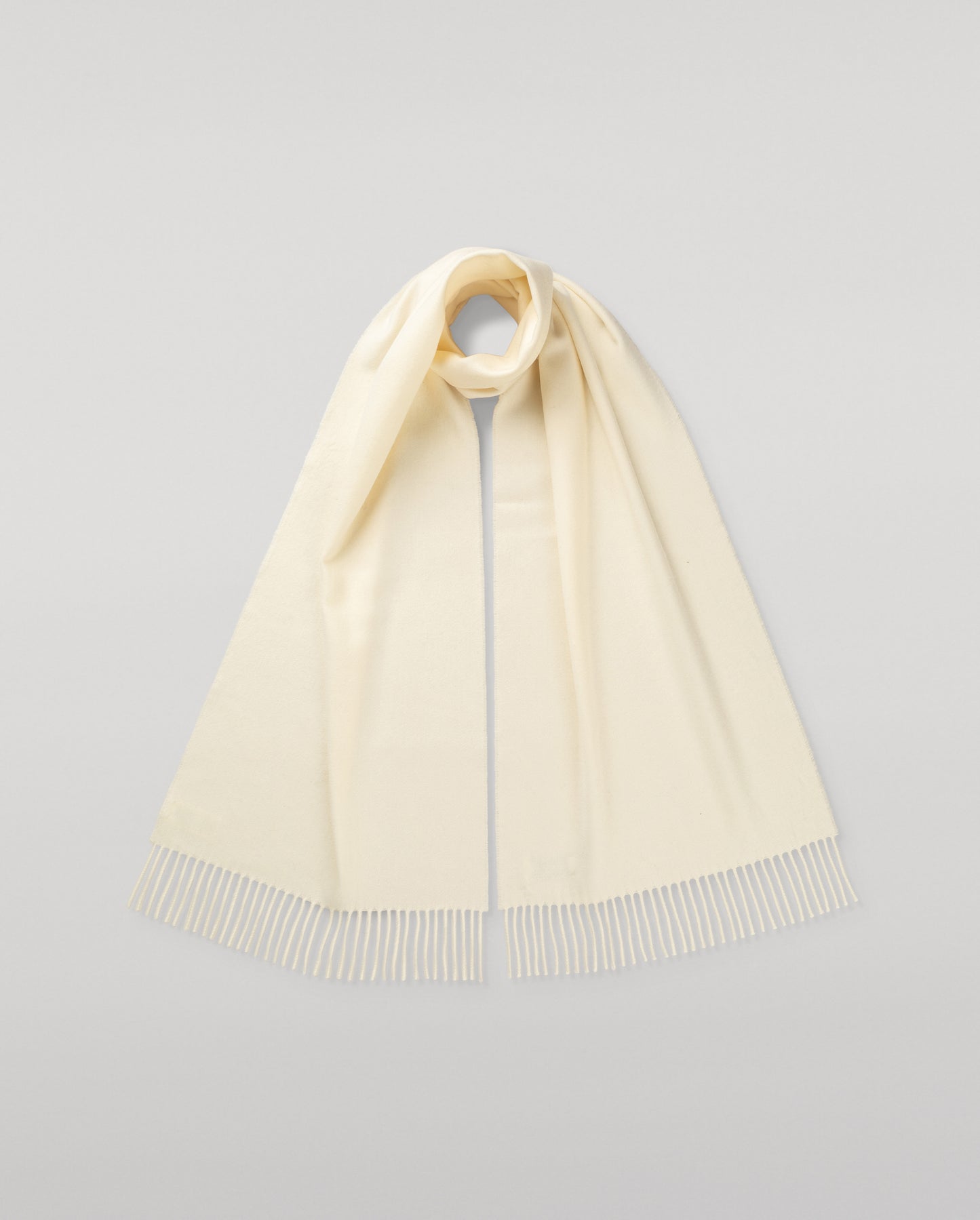 Johnstons of Elgin Ultrafine Merino Wool Scarf in White on a white background WDC01797SA0000ONE