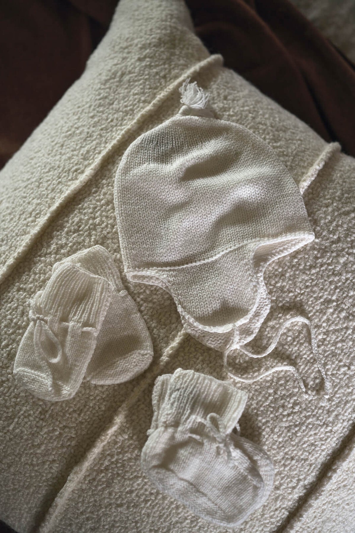 Johnstons of Elgin’s Baby's 1st Cashmere Accessories Gift Set in White on a cream cushion AW21GIFTSET20A
