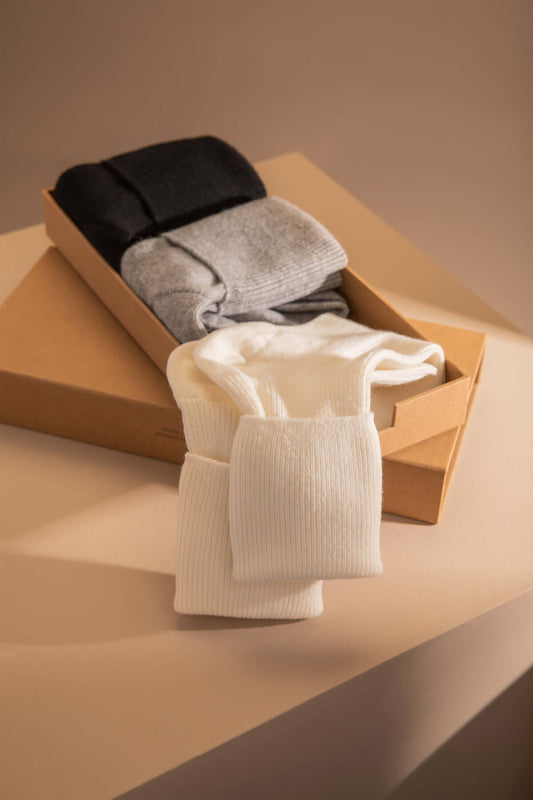 Johnstons of Elgin Gift Set includes 3 pairs of Women's Cashmere Socks in Black, Silver & Ecru on a beige background 365GIFTSET1A