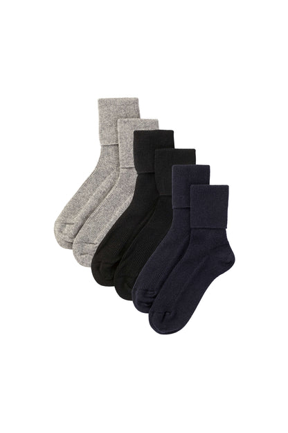 Johnstons of Elgin set of grey, black and navy cashmere socks on a white background 2025GIFTSET1A