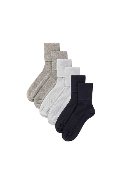 Johnstons of Elgin set of three cashmere socks in grey, blue, and navy on a white background 2025GIFTSET1B
