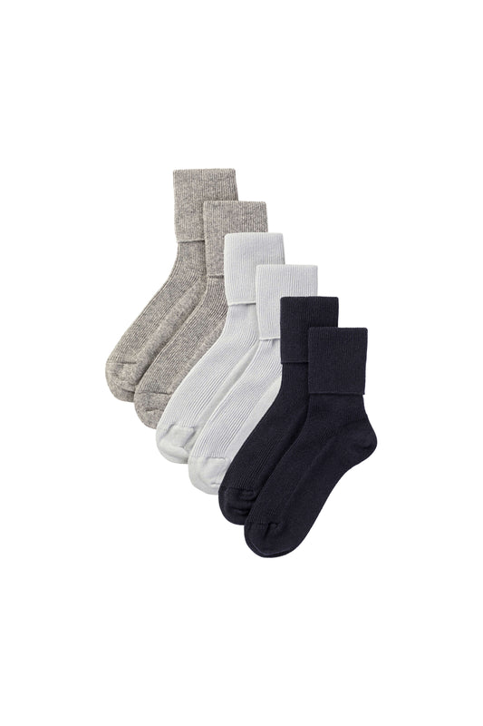 Johnstons of Elgin set of three cashmere socks in grey, blue, and navy on a white background 2025GIFTSET1B