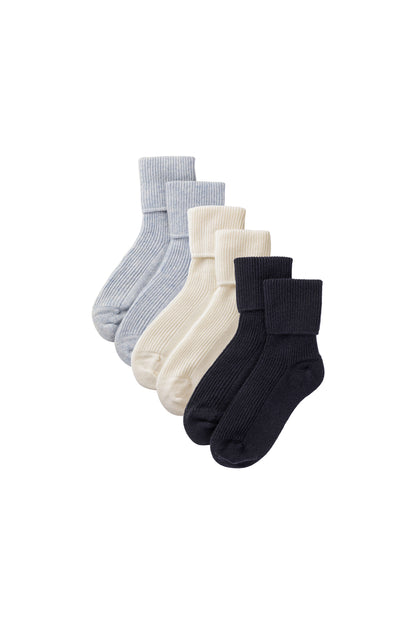 Johnstons of Elgin set of three pairs of cashmere socks in light blue, white, and navy on a white background 2025GIFTSET3B