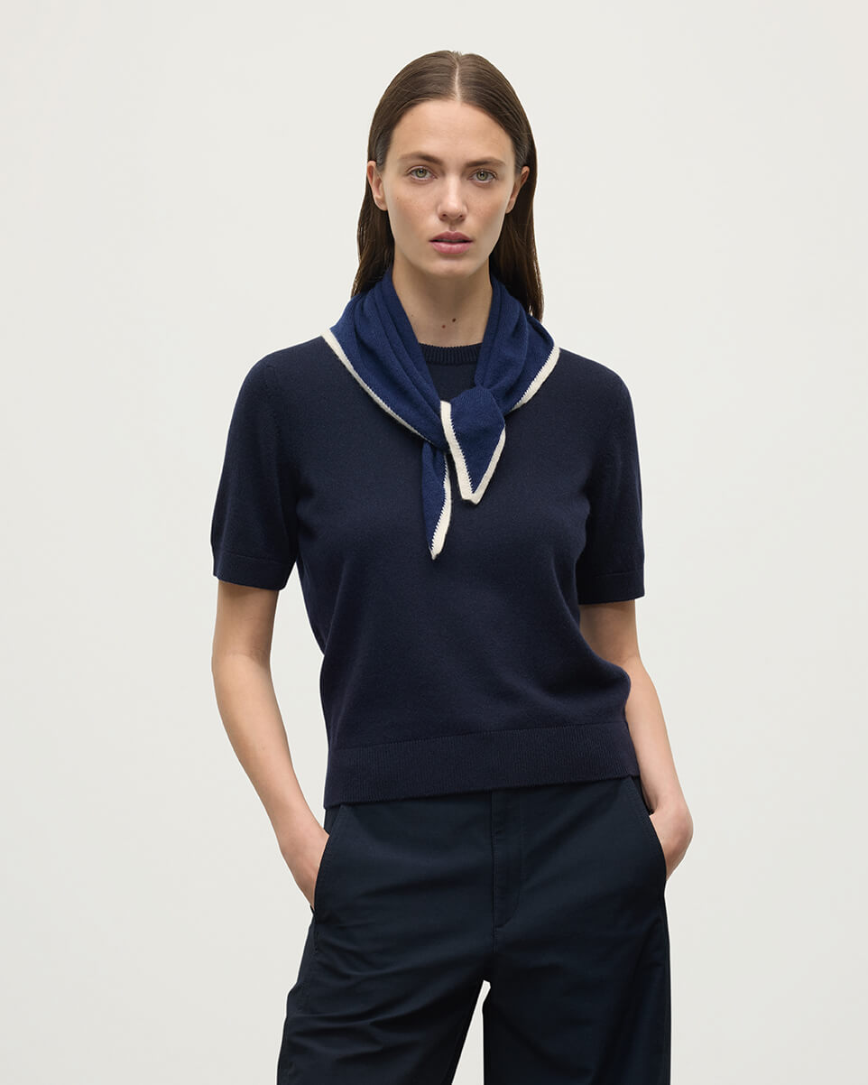 Model wearing Johnstons of Elgin Knitted Accessories  Double Faced Navy Cashmere Triangle with short sleeve navy cashmere t-shirtHAE02939Q24454ONE