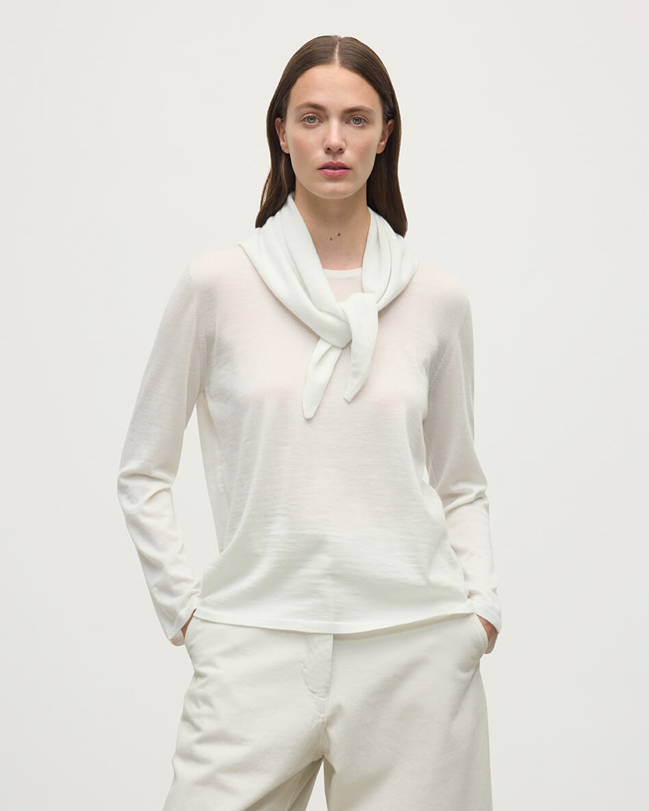 Model wearing Johnstons of Elgin AW25 Knitted Accessories  Gauzy Cashmere White Triangle Neck Tie with matching cashmere sweater HAE03430HA0371ONE