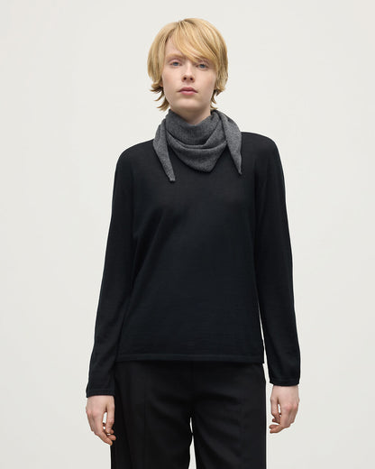 Model wearing Johnstons of Elgin AW25 Knitted Accessories  Gauzy Cashmere Grey Triangle Neck Tie with black cashmere sweater HAE03430HA4181ONE