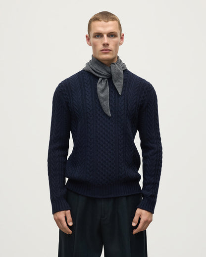 Model wearing Johnstons of Elgin AW25 Knitted Accessories  Gauzy Cashmere Grey Triangle Neck Tie with navy cashmere sweater HAE03430HA4181ONE
