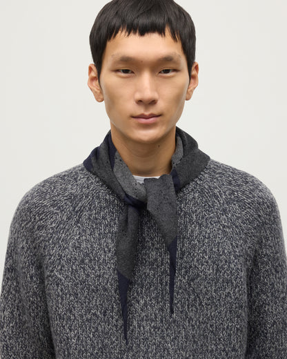 JOHNSTONS OF ELGIN CLAN BANDANA NAVY 100% CASHMERE ON A MALE MODEL OVER A NAVY MARL CASHMERE SWEATER HAP03612JU1613ONE