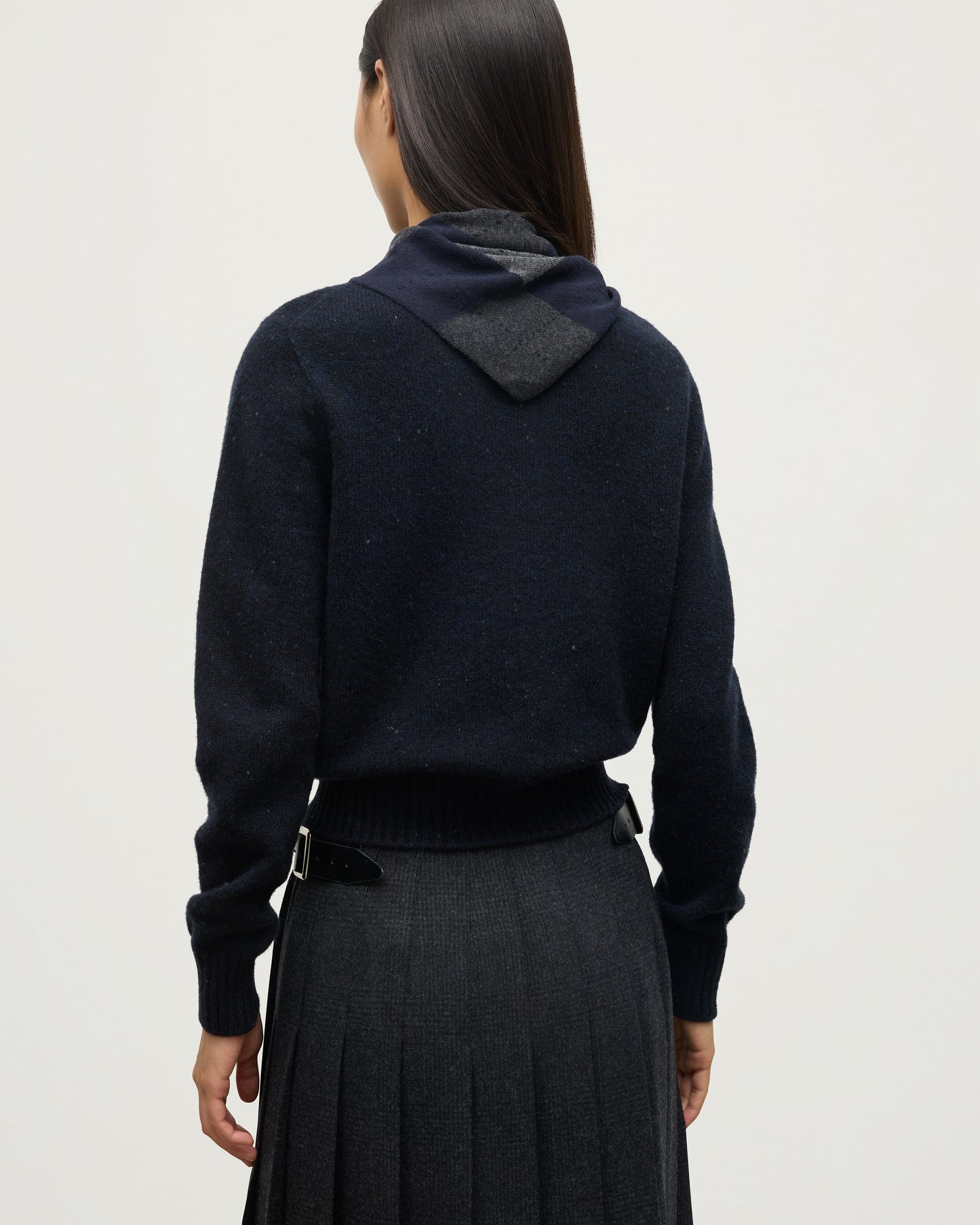 JOHNSTONS OF ELGIN CLAN BANDANA NAVY 100% CASHMERE ON A FEMALE MODEL OVER A NAVY MARL CASHMERE SWEATER HAP03612JU1613ONE