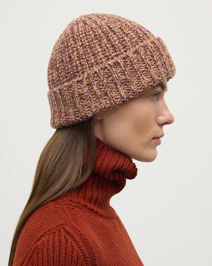 Model wearing Johnstons of Elgin AW25 Knitted Accessories Dark Camel Marl Half Cardigan Stich Red Cashmere Beanie HAT02850006360ONE