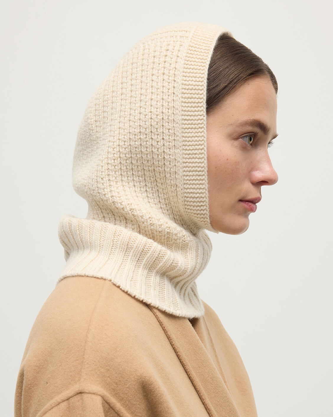 Model wearing Johnstons of Elgin AW25 Knitted Accessories Champagne Waffle Stitch Cream Cashmere Hood HAY03522SA0502ONE