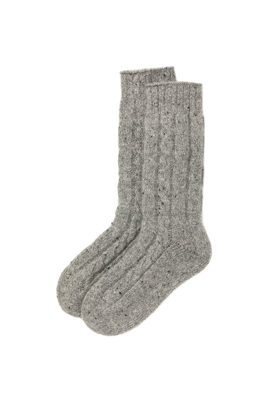 Johnstons of Elgin’s Light Grey Donegal Cable Cashmere Socks on a white background HBY01023002674
