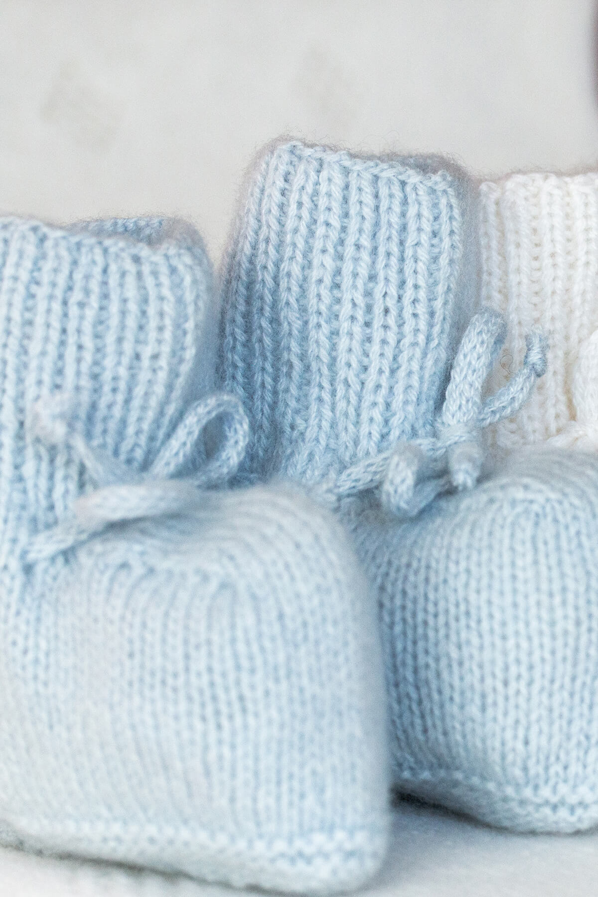 Johnstons of Elgin Hand Knitted Cashmere Baby Booties in Powder Blue on white 617112809ONE