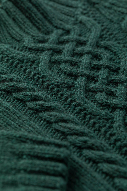 Johnstons of Elgin children's cashmere sweater in dark green lying on a white background JA000106HC4103
