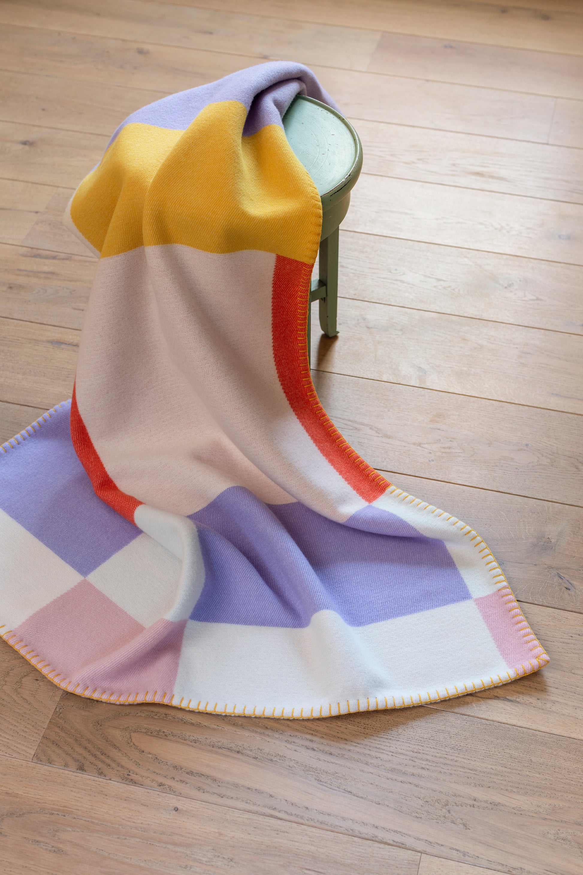 Johnstons of Elgin’s Lilac & Yellow Kids Colour Block Blanket Stitch Throw on a white background TB000582RU7281ONE