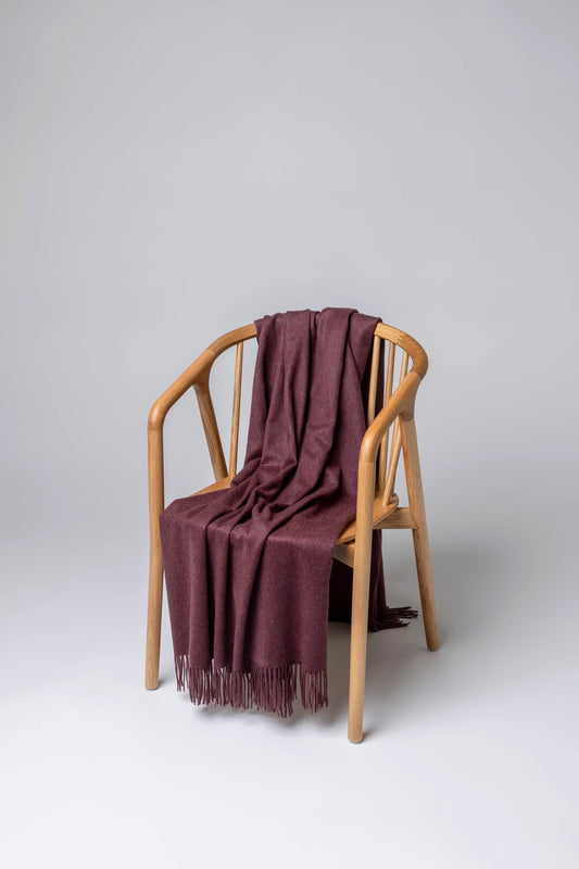 2025 Johnstons of Elgin Interiors Collection Damson Damson Cashmere Throw on a grey background  WA000055HE7062ONE