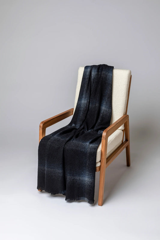 2025 Johnstons of Elgin Interiors Collection Black Blurred Bouclé Throw on a grey background  WB002788RU7670ONE