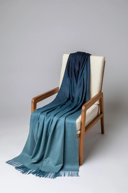 2025 Johnstons of Elgin Interiors Collection Seascape & Navy Ombré Cashmere Throw on a grey background  WA000055RU7686ONE