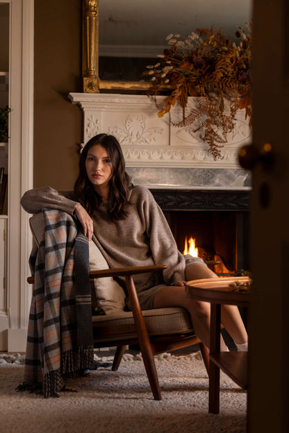 The Alexander Johnston Anniversary Blanket from Johnstons of Elgin in shades of grey, amber and blue WDC01946RU769500