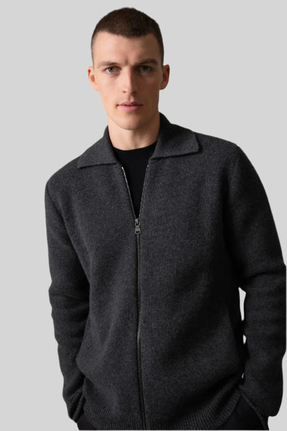 Johnstons of Elgin’s Men's Milano Stitch Cashmere Zip Jacket in Charcoal grey on model wearing black trousers on a grey background KAA05113HA7165