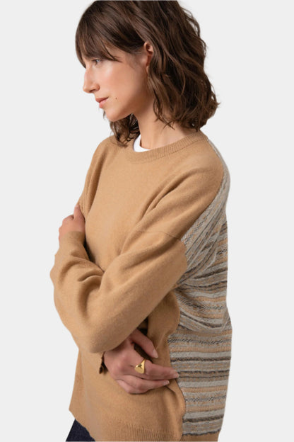 Side view of Johnstons of Elgin Women's Round Neck Fair Isle Back Jumper in Camel on a grey background KAA05152Q23722