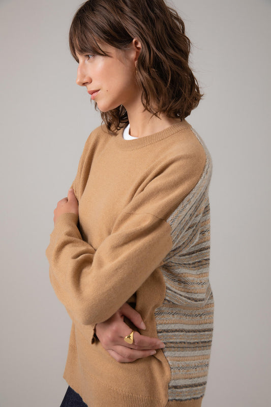 Side view of Johnstons of Elgin Women's Round Neck Fair Isle Back Jumper in Camel on a grey background KAA05152Q23722